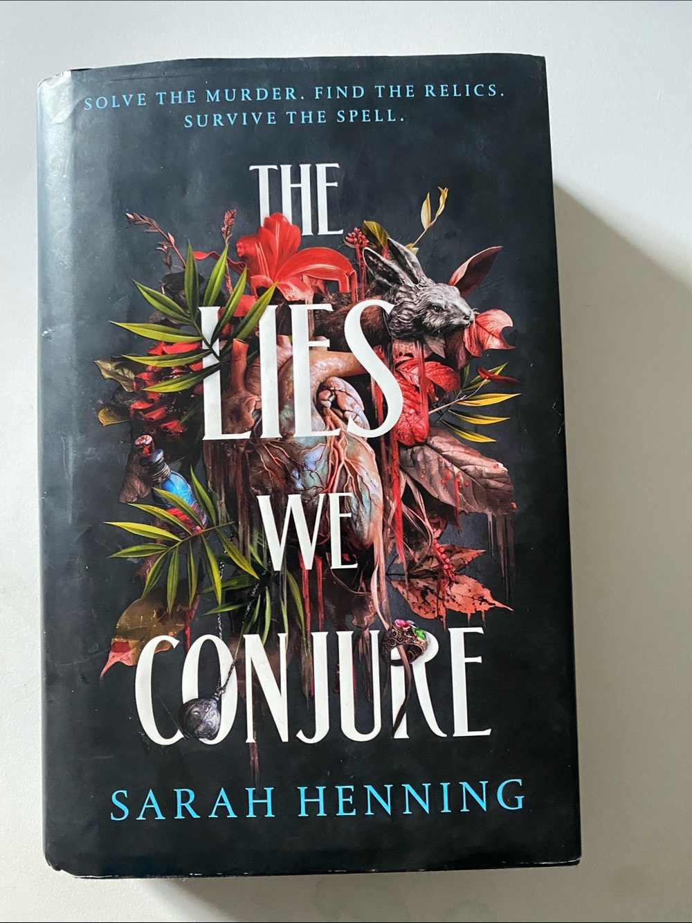 "The Lies We Conjure" Hardcover Book - Black Cover